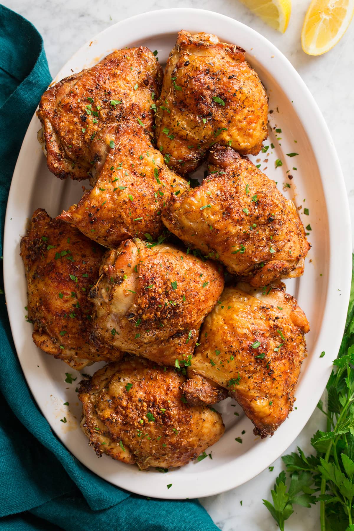 baked chicken thighs beautifully presented from an overhead angle