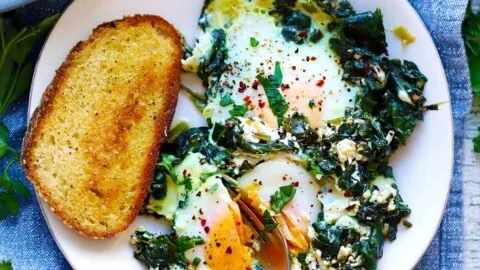 Creamy spinach with eggs served in a bowl for a healthy breakfast option