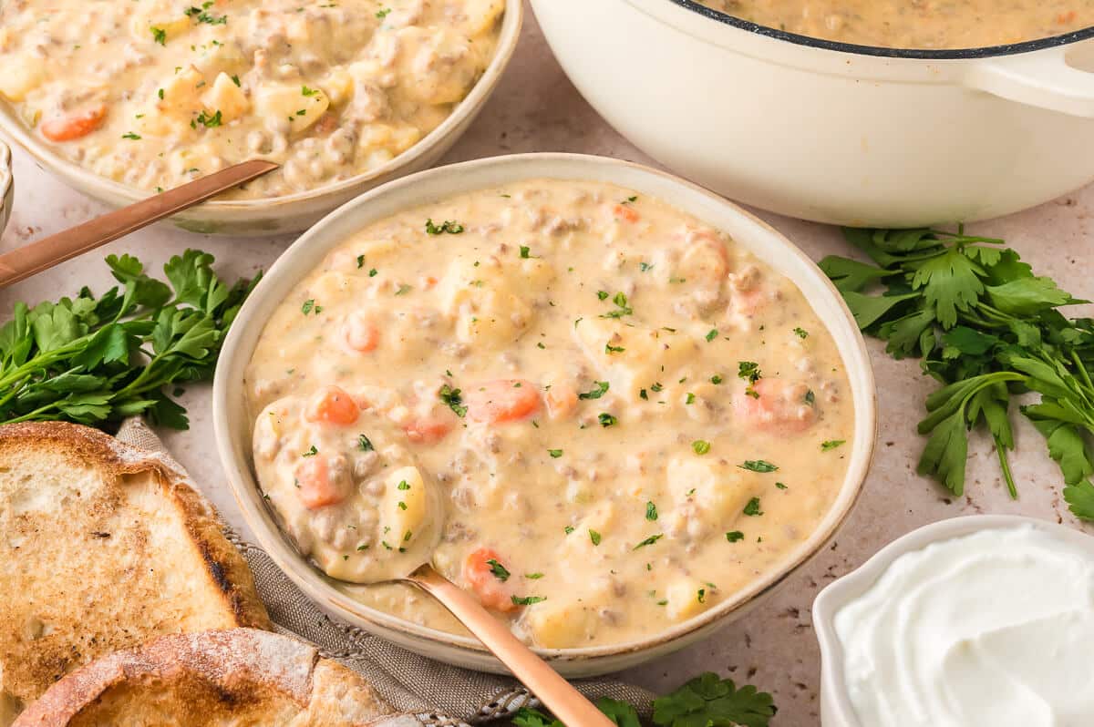 cheeseburger chowder beautifully presented from an overhead angle