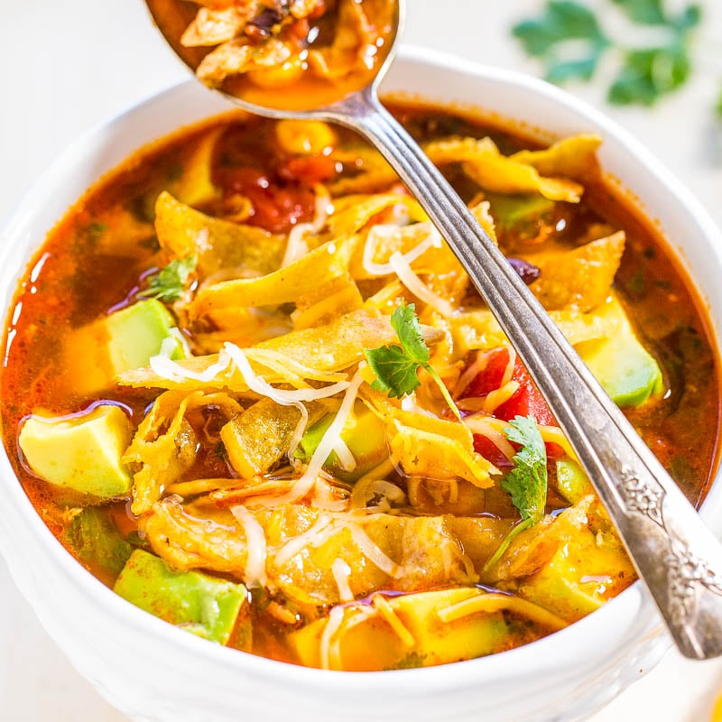 chicken tortilla soup beautifully presented from an overhead angle